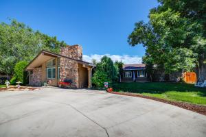 a house with a driveway in front of it at Broadmoor Getaway with Pickleball Court! in Colorado Springs