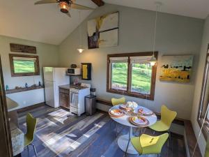 a kitchen with a table and chairs in a room at Corsa's Pillowfort in Juneau