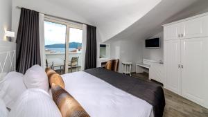 Кровать или кровати в номере Motto Premium Hotel&Spa