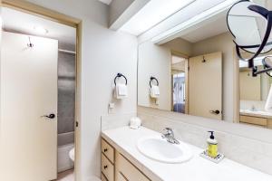 a bathroom with a sink and a mirror at Bliss at the Base in Ketchum