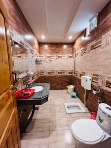 A bathroom at Grand cottages kalam