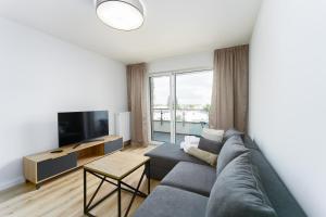 TV a/nebo společenská místnost v ubytování Apartament Morski Navigator by HolidaySun