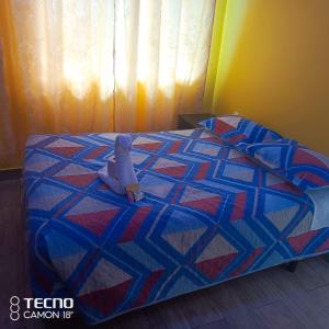 Letto o letti in una camera di HOSPEDAJE YACUCALLE