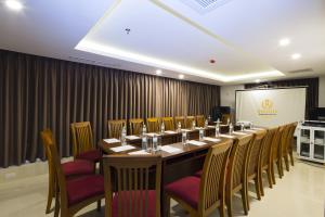 a conference room with a long table and chairs at Regalia Nha Trang in Nha Trang +114 photos