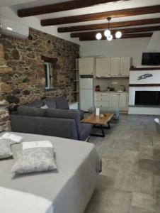 a living room with a couch and a table at Karystos Chora Suites in Karistos