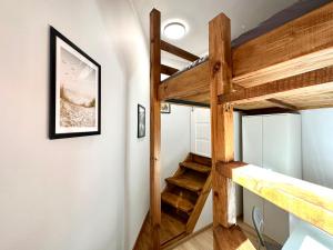 a loft bed in a tiny house at MMRent Valley Room in Gdańsk