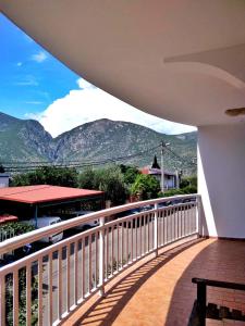 a balcony with a view of the mountains at Apartman ASI in Mostar