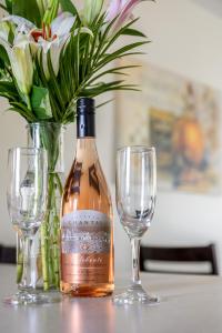 a bottle of wine and two glasses on a table at Beautiful Bay View Couples Retreat at The Shores 5586 in Traverse City