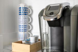 a coffee maker sitting on top of a counter at Beautiful Bay View Couples Retreat at The Shores 5586 in Traverse City
