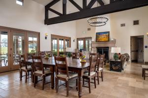 a dining room with a wooden table and chairs at Grand Reserve Inn in Plymouth