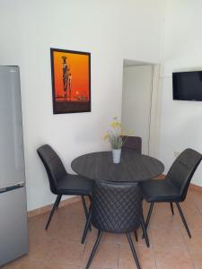 a dining room with a table and chairs at Apartments with a parking space Njivice, Krk - 14932 in Njivice