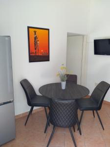 a dining room with a table and chairs at Apartments with parking space Njivice, Krk - 14932 in Njivice
