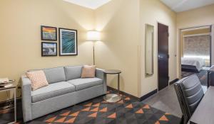 a living room with a couch and a bed at Holiday Inn Hotel & Suites Waco Northwest, an IHG Hotel in Bellmead
