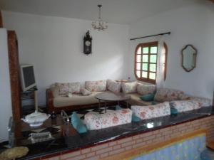 a living room with a couch and a table at Amsa aqua villa in Tétouan