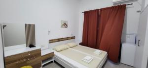 Cama ou camas em um quarto em Apartmani Vila Milaris