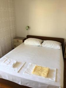 Postel nebo postele na pokoji v ubytování Apartments and rooms with parking space Hvar - 15706