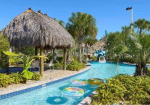 a swimming pool with a resort with a resort at Disney 8BR South Pool Theater Arcade Harry Potter Room in Davenport