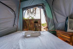 Postel nebo postele na pokoji v ubytování Skycamp Camping Holbox
