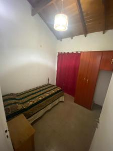 Tempat tidur dalam kamar di Casa zona Hospital/UNNOBA