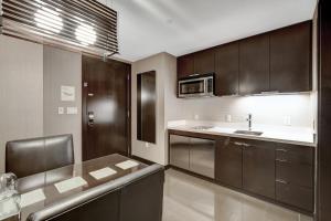 a kitchen with a sink and a counter top at Vdara Hotel & Spa Private Residences in Las Vegas +93 photos