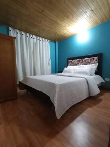 Letto o letti in una camera di Guaxique