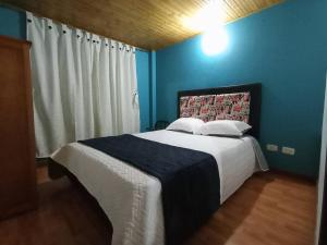 Letto o letti in una camera di Guaxique