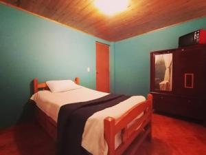 Letto o letti in una camera di Guaxique