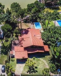 an aerial view of a house with a swimming pool at Beach & Golf Retreat w Amazing pool, By TimeCooler in Aroeira