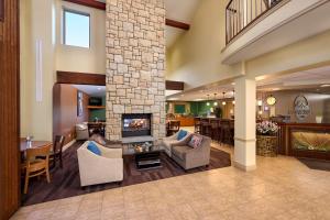 a lobby with a living room with a fireplace at Mountain Valley Lodge Hailey Sun Valley in Hailey