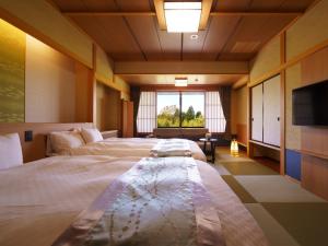 Cama o camas de una habitación en Hotel Seifuuen