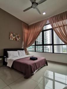 a bedroom with a bed and a large window at Conezion Residence Putrajaya WiFi Netflix in Putrajaya