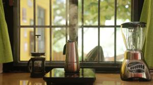 a blender sitting on a table next to a window at Habitacion Roja / Casa del Café in Campeche