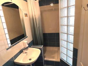 a bathroom with a sink and a shower at Apartments MiaMaja in Novalja +37 photos