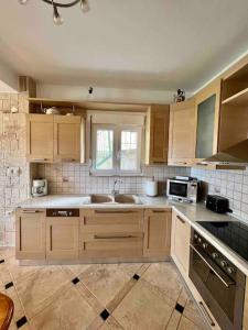 a kitchen with a sink and a stove top oven at #ALS- Stone Maisonette in Paliouri in Paliouri +25 photos