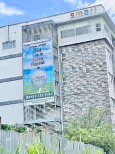 a building with a banner on the side of it at 3 Smart Condominium in Cagayan de Oro City in Cagayan de Oro