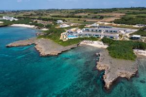 an aerial view of a house on a island in the ocean at アルカディアリゾート宮古島 in Irabu