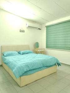 Кровать или кровати в номере AAA Homestay Georgetown Penang