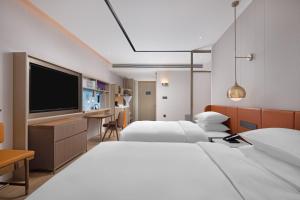 Posteľ alebo postele v izbe v ubytovaní Home2 Suites by Hilton Hefei South Railway Station