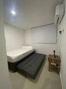 Apartamento en exclusivo lugar de Neiva tesisinde bir odada yatak veya yataklar