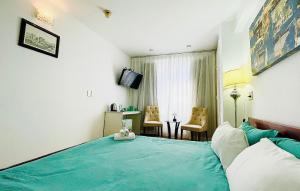 Rúm í herbergi á Onestar Danang Riverside