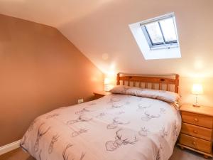 Postel nebo postele na pokoji v ubytování Mulgrave Cottage