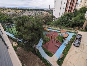 an overhead view of a park with a playground at Sphera Bagebi Apartment in Tbilisi City