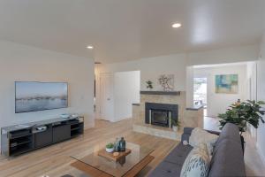 a living room with a couch and a fireplace at 3896 Gather and Rest home in Del Rey Oaks