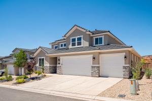 a house with two garage doors on a street at Family Desert Oasis home in Washington