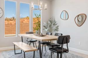 a dining room with a wooden table and chairs at Family Desert Oasis home in Washington