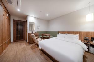 Katil atau katil-katil dalam bilik di Simjak Hotel by Aank