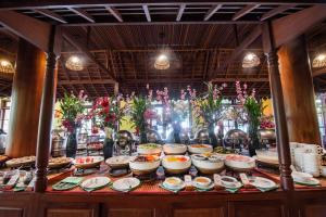 a buffet with many plates of food on a table at Royal Crown Hotel & Spa in Siem Reap