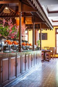 a buffet line in a restaurant with food on it at Royal Crown Hotel & Spa in Siem Reap