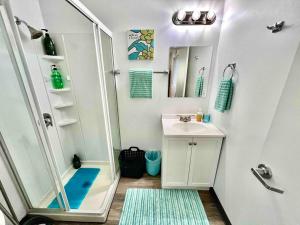a small bathroom with a shower and a sink at Micro Studio Apartment 10 Minutes walk to University of Washington in Seattle +32 photos