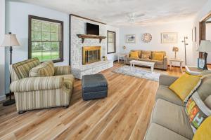 a living room with two couches and a fireplace at 5 Mi to Boardwalk Myrtle Beach Home Near Golfing in Myrtle Beach